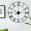 Vintage 40CM Black Metal Wall Clock – Timeless Home Decor Description: “Make a bold statement with this 40CM vintage metal wall clock. Featuring a striking open back design, metal numerals, and a distressed frame, it adds character to any room. Powered by AA battery, it’s suitable for indoor and sheltered outdoor use. Home & Garden Free Shipping 21