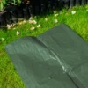 Green medium duty tarpaulin 5m x 8m with 10m of 6mm bungee rope & 10 tarp clips (screw type) kit